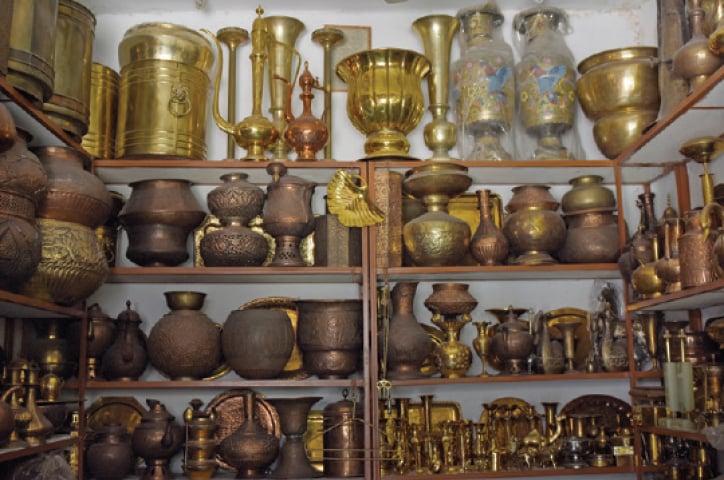 Polished and unpolished brass items on display at a shop in Bhabra Bazaar. Photo Credits: Dawn.pk
