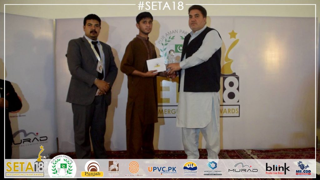 Filmmaker Ahsan Khan receiving award at SETA